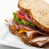 The Jamaican Jerk Turkey Sandwich · Elegant jamaican jerk turkey sandwich with customer's choice of bread, cheese and toppings.