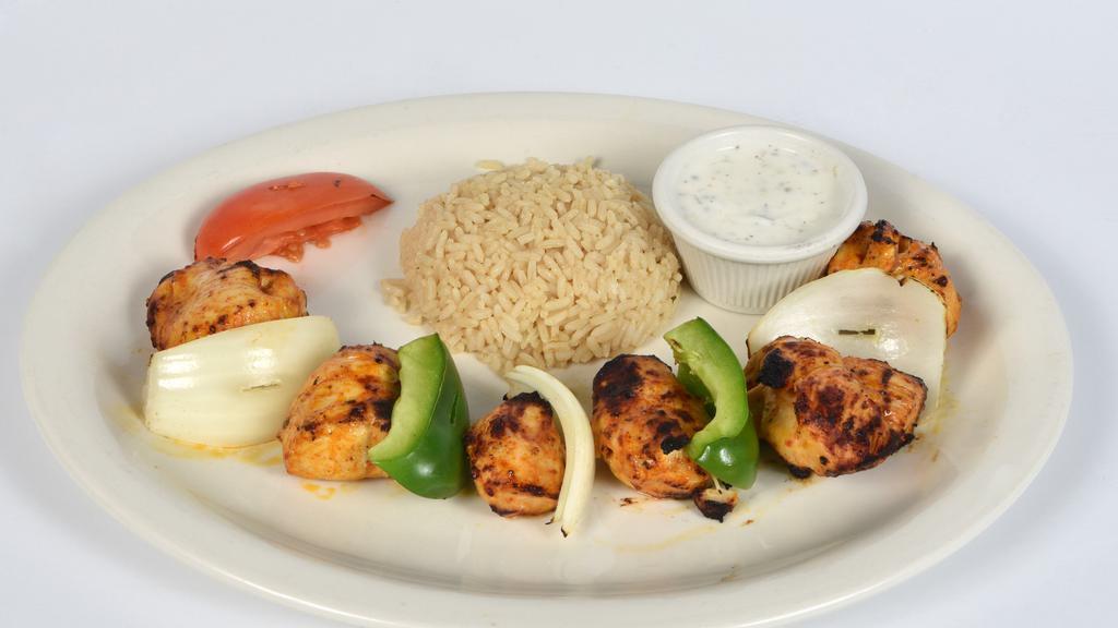 Chicken Shish · Gluten free. Charcoal grilled tender chunks of marinated chicked breast skewered. Served with rice and vegetables.