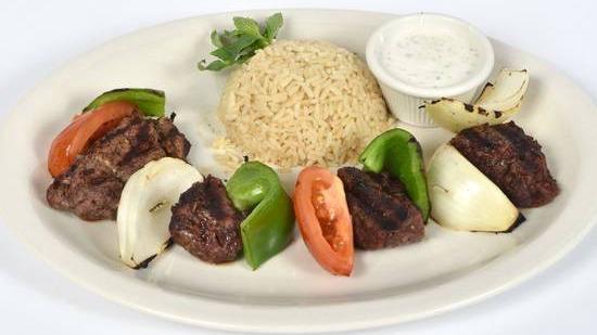 Lamb Shish Kebab · Gluten free. Marinated skewered tender lamb cubes served with rice pilaf and vegetables. Consuming raw or undercooked meats, poultry, seafood, shellfish, or eggs may increase your risk of foodborne illness.