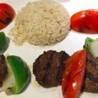 Kofte · Chopped lamb meat patties served with rice pilaf and vegetables.