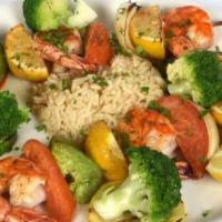 Shrimp Shish Kebab · Jumbo shrimp skewered with vegetables charcoal grilled served with rice pilaf. Served with h...