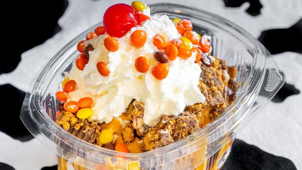 Reese'S Delight Sundae · Peanut butter chip swirl ice cream, crushed reese's peanut butter cups with chocolate drizzle, peanut butter drizzle and topped with mini reese's pieces.          *** our products may contain nuts ***