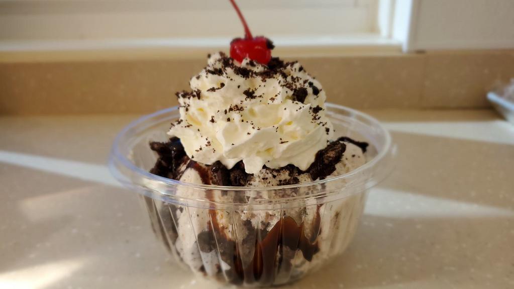 Oreo Delight Sundae · Oreo ice cream, hot fudge, topped with oreo cookie crumbles. *** our products may contain nuts ***
