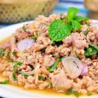  Larb Gai · Spicy. A generous portion of ground chicken, onions, scallion and Thai herbs in a fresh lime...