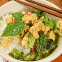 Green Curry · Spicy. Authentic green curry paste cooked in coconut milk, bamboo shoots, string beans, eggp...