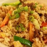 Thai Fried Rice · Stir-fried jasmine rice with egg, tomatoes, onions, scallion and carrot.