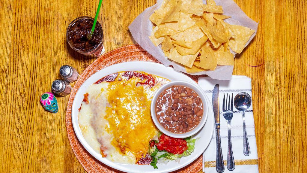 Enchiladas · Choice of two cheese and onion enchiladas, two ground beef or chicken.
