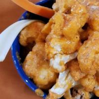 Ancho & Cascabel Hot Wings · Battered & fried cauliflower tossed in ancho & cascabel buffalo sauce, served with carrots, ...