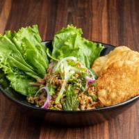 Chicken Laab · Share | Ground chicken salad with fresh herbs, chili powder, toasted rice powder, fish sauce...
