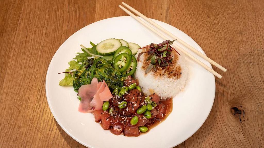 Tuna Poke · Entree | Tuna tossed in a sesame soy glaze, seaweed salad, cucumbers, ginger, edamame & rice. (Gluten-free)