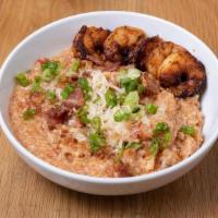 Shrimp And Grits · Entrée | Roasted tomato grits, white cheddar, bacon, chili oil. (Gluten-free)