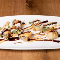 Las Vegas Roll · Sushi Roll | Kani kama crab, salmon, tempura battered cream cheese, fried with eel sauce & s...