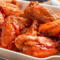 Chicken Wings · Crispy and juicy chicken wings served with your choice of sauce: Buffalo, Smoky BBQ, or Swee...