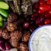 Messa Platter · Ideal for sharing! Stuffed grape leaves, Kalamata olives, homemade tzatziki sauce, grilled s...