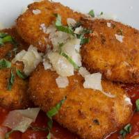 Pan-Fried Mozzarella · Homemade pan-fried fresh mozzarella coated in seasoned bread crumbs, served with homemade ma...