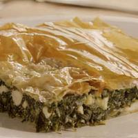 Spanakopita · Flaky filo dough filled with sautéed spinach and fresh herbs, set over field greens & topped...