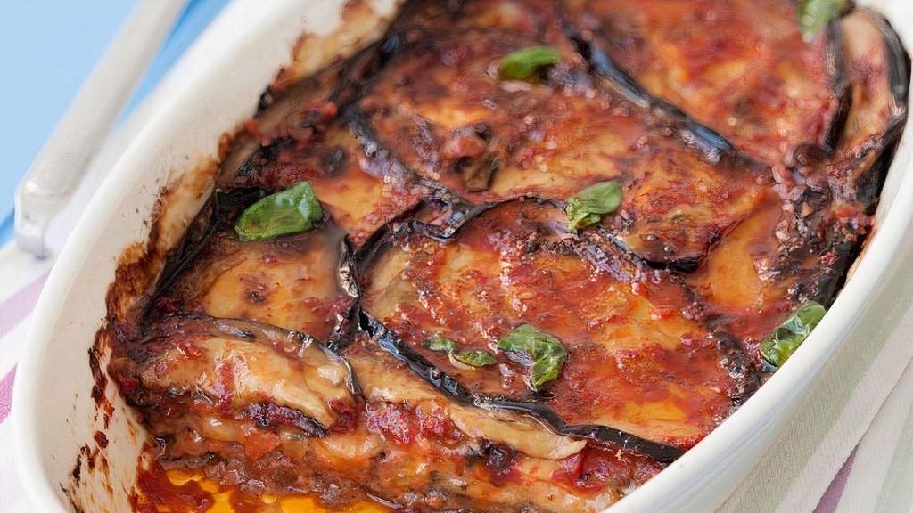 Melanzane Parmigiana · Lightly breaded eggplant, baked in plum tomato sauce with mozzarella. Vegetarian Option