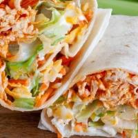Buffalo Chicken Wrap · Grilled Chicken tossed in Buffalo sauce with lettuce, tomato & creamy blue cheese dressing