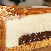 Gourmet New York Turtle Cheesecake · New York Style Turtle Cheesecake, every slice is Heaven, beginning with a thick layer of fud...