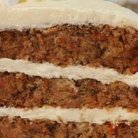 Layered Carrot Cake · Three Delicious Layers of moist Cake Loaded with shredded carrots, pecan pieces and crushed ...