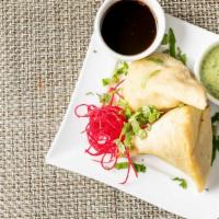 Samosa · Veggie. Seasoned potato and peas wrapped in a light pastry pouch.