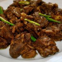 Kerala Coconut Lamb · Peppered lamb cubes sauteed with coconut flakes, onions, spices and finished with curry leav...