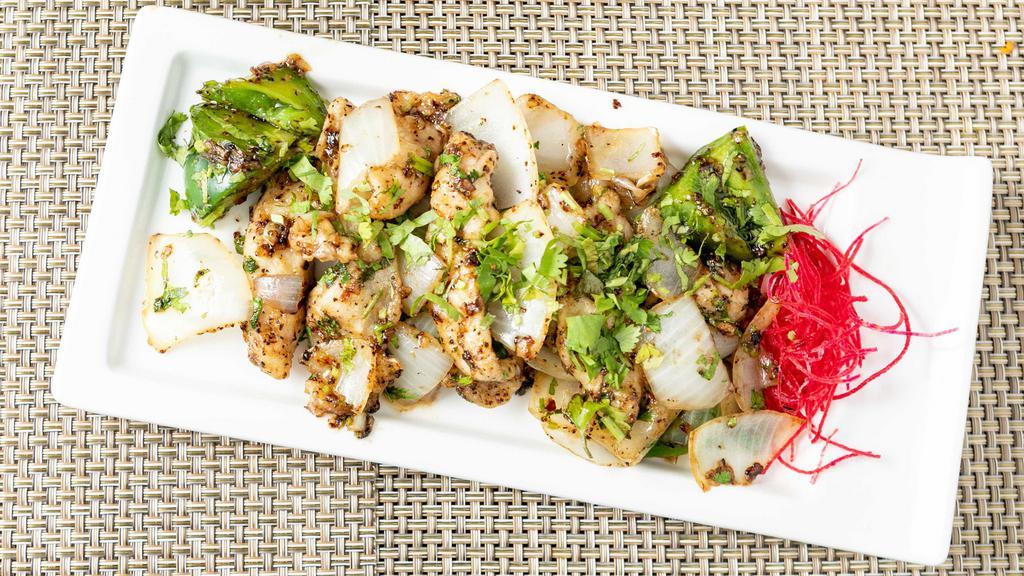 Salt & Pepper Fish · Spicy. Diced tilapia sauteed with crushed black pepper, ginger, garlic, onions, green peppers, and soy.