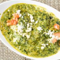 Traditional Saag · Coarsely chopped spinach cooked with ginger, cumin, fenugreek finished with an unique spice ...