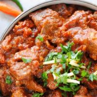 Goat Kadai · Cooked in semi dry gravy with diced onions, plum tomatoes and green pepper