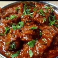 Dhaba Gosht (Lamb) · Slowly braised lamb cubes in an abundance of spices and herbs.