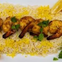 Shrimp Tandoori · 8 pcs shrimp tandoori serve with rice, salad, naan and sauce.