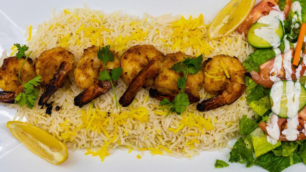 Shrimp Tandoori · 8 pcs shrimp tandoori serve with rice, salad, naan and sauce.