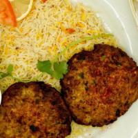 Chicken Chapli Kabab    · 2 Pieces of marinated minced meat.
