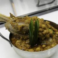 Lamb Shank With Chick Peas · comes with 2 naan bread , salad & sauce.