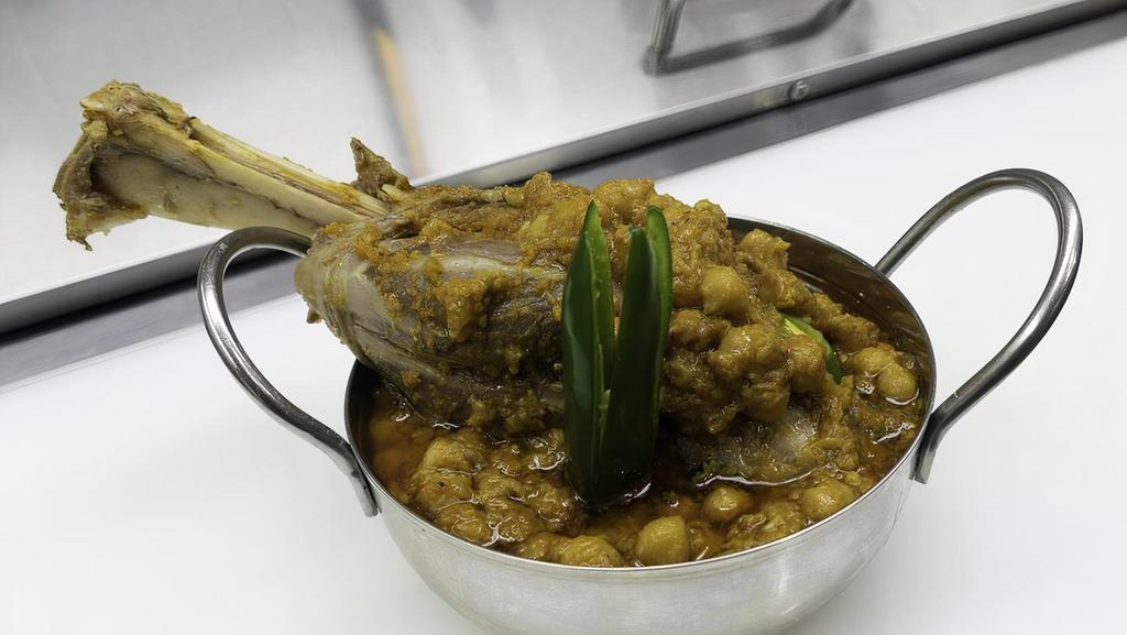 Lamb Shank With Chick Peas · comes with 2 naan bread , salad & sauce.