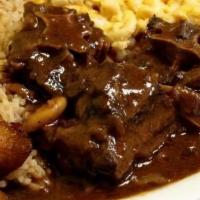 Oxtail  · Served with rice and peas or white rice.