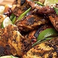 Jerk Chicken · Served with rice and peas or white rice.