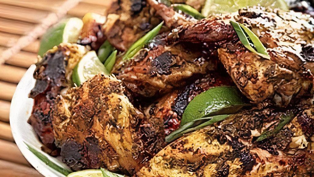 Jerk Chicken · Served with rice and peas or white rice.