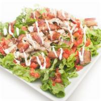 Chicken Blt Salad · Choice of grilled or crispy chicken with plum tomato and bacon served over a bed of green le...