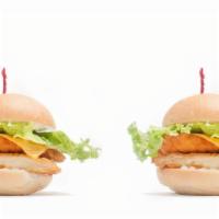Chicken Jr · Two chicken sandwiches with melted American, green leaf and hellmann's mayo.
