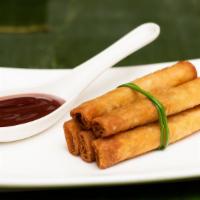 Mama Alices' Lumpia (5 Pieces) · Fried beef and pork spring rolls with banana ketchup dipping sauce.
