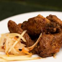 Fried Spicy Adobo Wings · Spicy adobo wings with a side of garlic aioli, eight per order