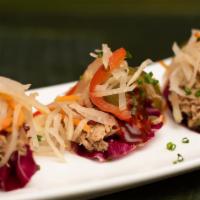 Adobo Radicchio Wraps · Radicchio wrapped braised chicken thigh cooked in adobo with atchara papaya salad and banana...