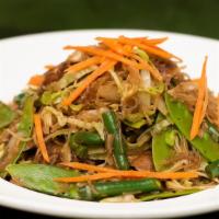 Pancit Bihon · Thin rice noodles sautéed with carrot, celery, onion, garlic, snow peas, cabbage, green bean...