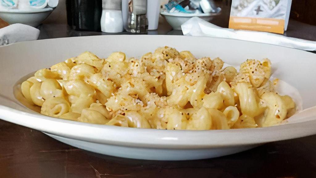 Mac N Cheese · Vegetarian. Cavatappi pasta tossed in our creamy cheddar and Parmesan cheese sauce. Topped with toasted panko bread crumbs. 1430 cal.