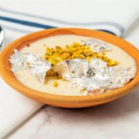 Kheer · Rice pudding. A traditional rice pudding flavored with pistachios and almonds.