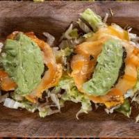 Mofongitos · Plantain cups filled with choice of protein: beef, chicken, shrimp. Guacamole, pink sauce an...