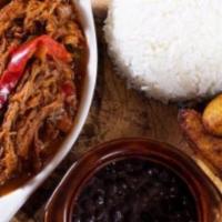 Ropa Vieja · A Cuban classic shredded beef simmered with tomatoes, bell peppers and sherry wine.