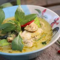 Green Curry · Green curry spices, cooked in coconut milk with bamboo shoot, bell pepper, green bean, carro...