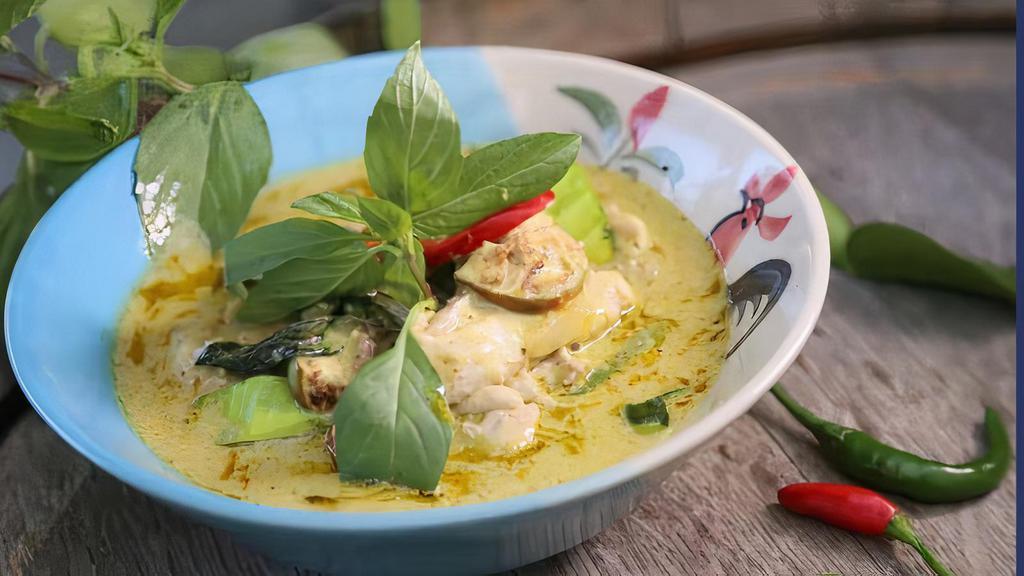 Green Curry · Green curry spices, cooked in coconut milk with bamboo shoot, bell pepper, green bean, carrot, eggplant, zucchini, and basil leaf.